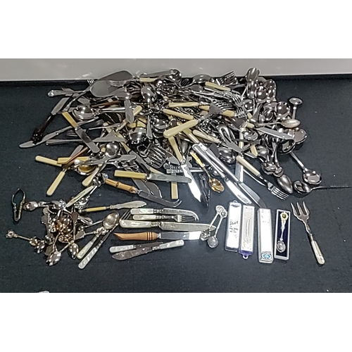 48 - A quantity of mixed flatware and serving implements, including silver plated and stainless steel cut... 