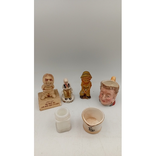 49 - A group of vintage novelty wares, comprising a character head mug, a crackle-glazed corporate match ... 