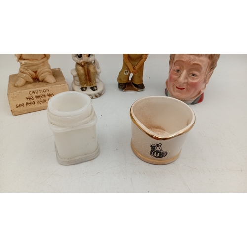 49 - A group of vintage novelty wares, comprising a character head mug, a crackle-glazed corporate match ... 
