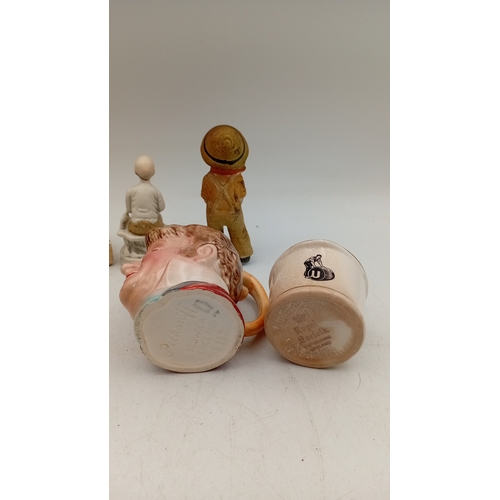 49 - A group of vintage novelty wares, comprising a character head mug, a crackle-glazed corporate match ... 