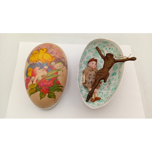 51 - A group of papier-mâché Easter egg-form novelty containers, printed with chicks, ribbons and floral ... 