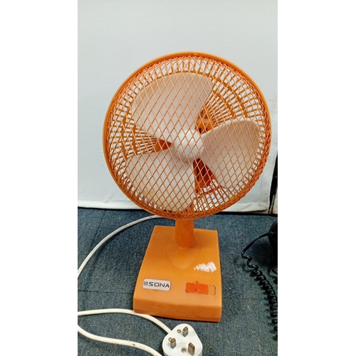52 - A group of late 20th century domestic items comprising a Sona orange plastic table fan with mesh gua... 