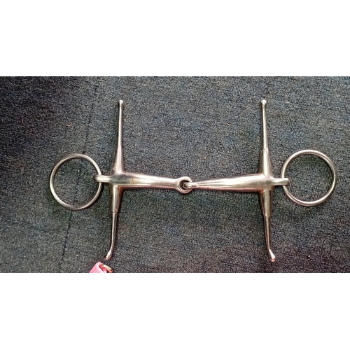 53 - An assortment of equestrian tack comprising a black synthetic treeless-style saddle with integrated ... 