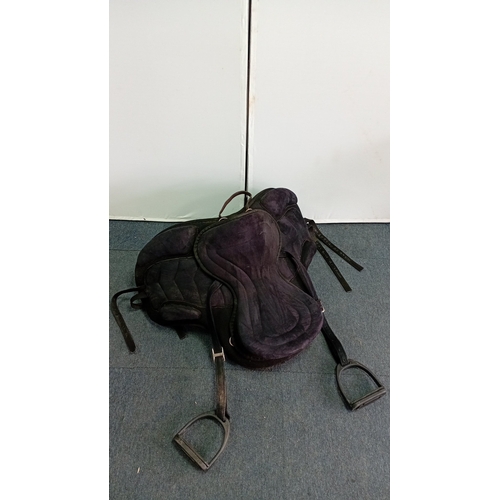 53 - An assortment of equestrian tack comprising a black synthetic treeless-style saddle with integrated ... 