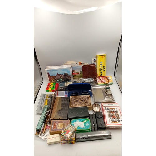 54 - A mixed lot of small ephemera and desk accessories, including a guillotine paper trimmer, playing ca... 