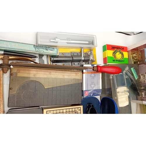 54 - A mixed lot of small ephemera and desk accessories, including a guillotine paper trimmer, playing ca... 