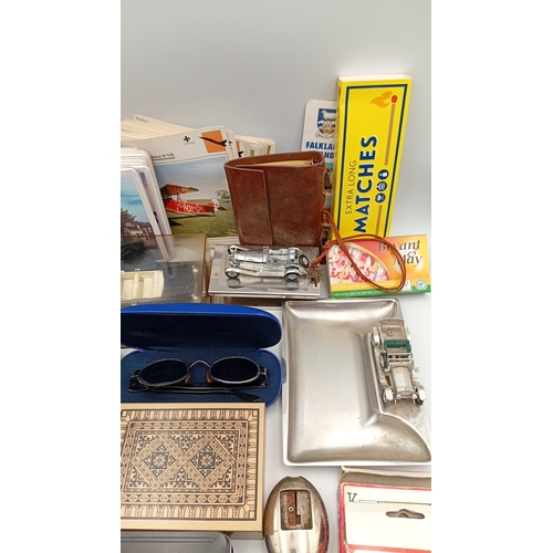 54 - A mixed lot of small ephemera and desk accessories, including a guillotine paper trimmer, playing ca... 