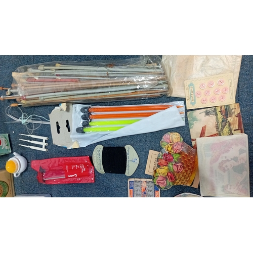 56 - A mixed group of sewing and knitting requisites, including a cat-decorated wooden drawer box, tins, ... 