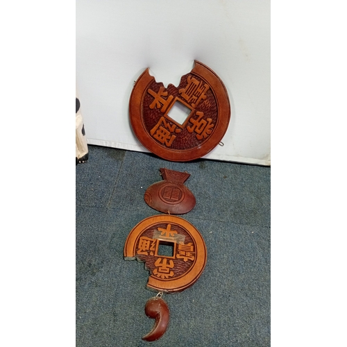 59 - A mixed decorative group comprising a carved hardwood occasional table with pierced foliate top and ... 