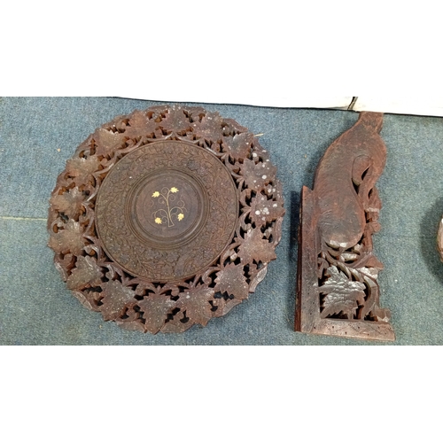 59 - A mixed decorative group comprising a carved hardwood occasional table with pierced foliate top and ... 