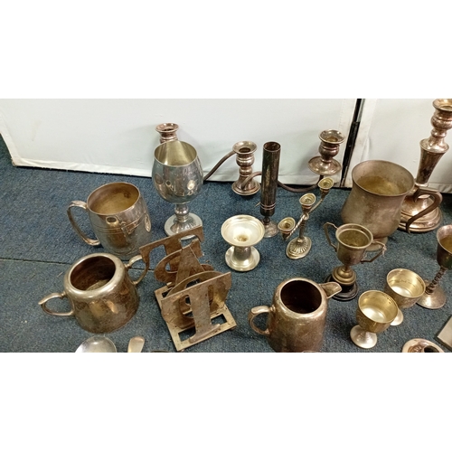 61 - A mixed lot of silver-coloured metalware and flatware, including a lidded teapot, goblets, candlesti... 