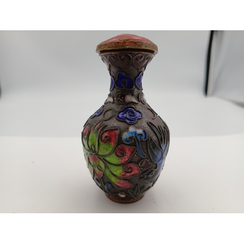 A Cloisonne snuff bottle with decorative floral design. Height 3 1/2 inches x Width 2 inches
