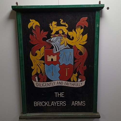 106 - A vintage painted double sided wooden pub hanging signboard, with green moulded frame and iron suspe... 