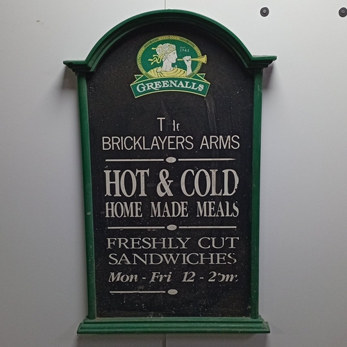 107 - A group of pub and catering chalkboards, comprising a Greenalls “The Bricklayers Arms” menu board in... 