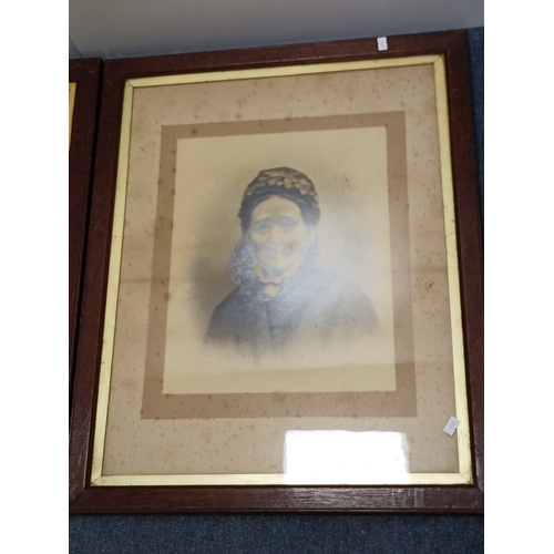 110 - A group of framed portrait photographs, late 19th/early 20th century, comprising two hand-coloured p... 