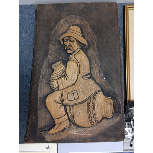 111 - A quantity of mixed ephemera, including a relief-carved wooden plaque of a seated figure, a framed C... 