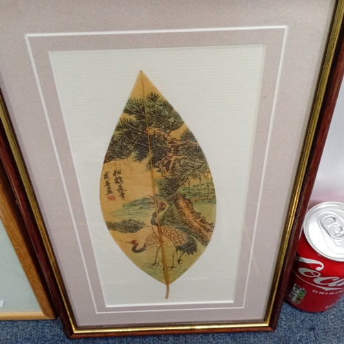 112 - A group of framed decorative works and objects including Chinese-style leaf painting with calligraph... 
