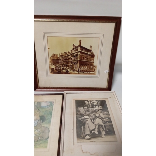 113 - A quantity of framed works on paper including sepia-toned architectural views, an aerial photographi... 