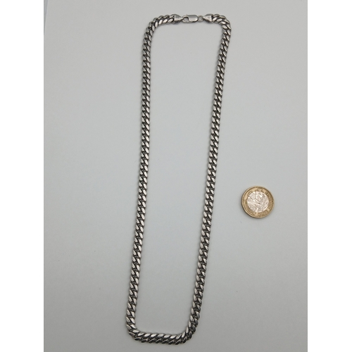 401 - A chunky stamped 925 silver cuban link necklace. Length 22 inches