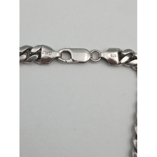 401 - A chunky stamped 925 silver cuban link necklace. Length 22 inches