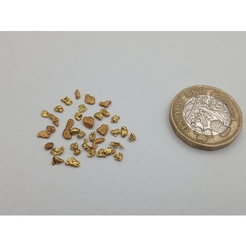 394 - A collection of tested 18ct gold nuggets. Total weight 2.07g