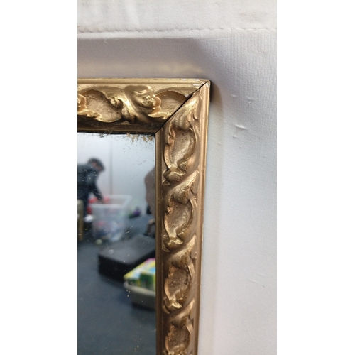 117 - Rectangular wall mirror with gilt-composition foliate-moulded frame, the plate within a bevelled sli... 