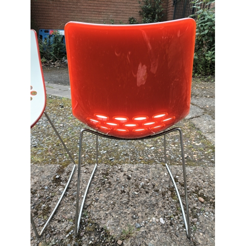 120 - A pair of Italian style designer chairs. Height 32 inches x width 18.5 inches.