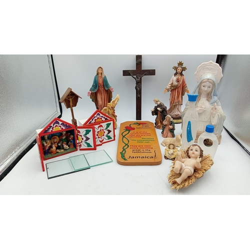 64 - A collection of devotional and souvenir items including polychrome resin figures, a wooden crucifix,... 