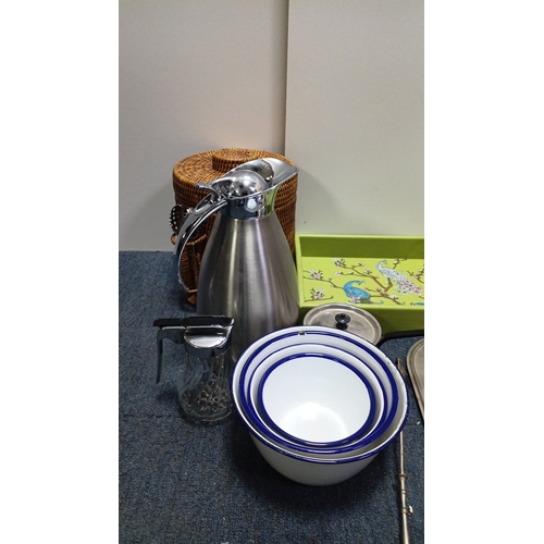 65 - A quantity of assorted domestic wares including a wicker picnic hamper, stainless steel vacuum jug, ... 