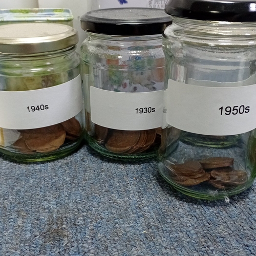 69 - A group of Peter Rabbit-related items including a ceramic money bank, a tea tin, a floral tin box, a... 