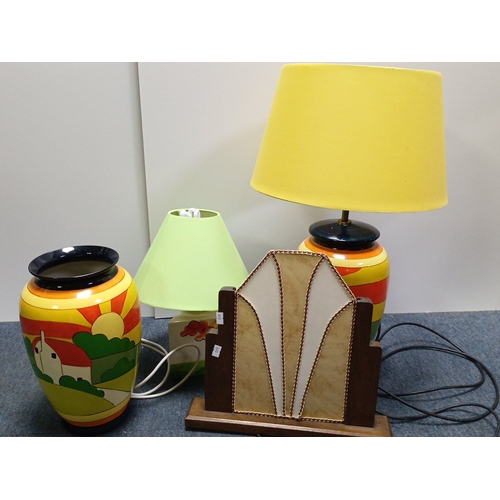 70 - A group of three 20th century table lamps, comprising two glazed ceramic baluster lamps painted with... 