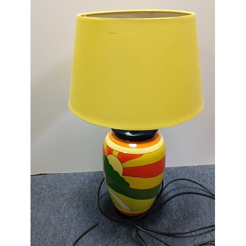 70 - A group of three 20th century table lamps, comprising two glazed ceramic baluster lamps painted with... 