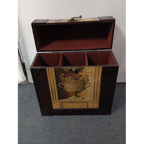 72 - A group of decorative caskets comprising a painted wooden wine carrier with hinged cover and compart... 
