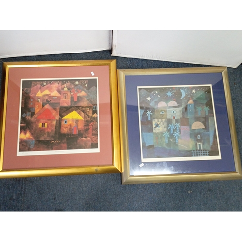102 - A pair of modern colour prints after Paul Klee—stylised nocturnal townscapes beneath stars and cresc... 