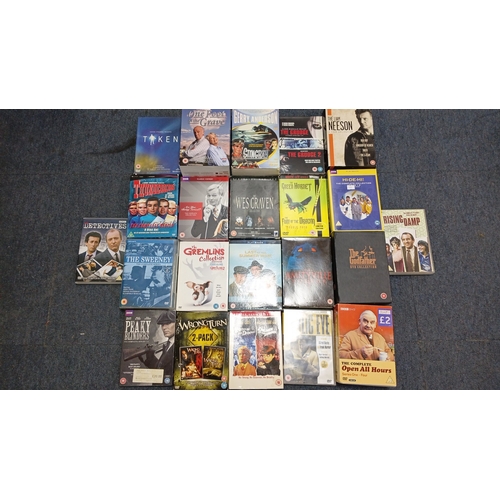 75 - A quantity of DVD box sets and feature films, chiefly television and cinema titles including Taken, ... 