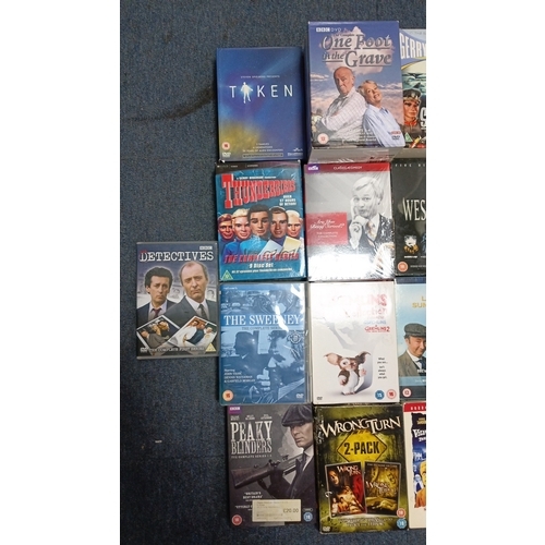 75 - A quantity of DVD box sets and feature films, chiefly television and cinema titles including Taken, ... 