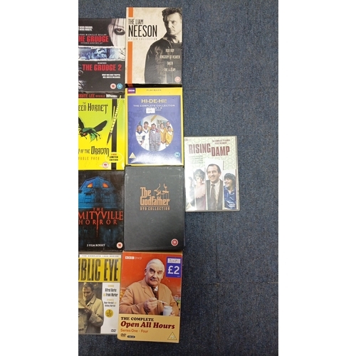 75 - A quantity of DVD box sets and feature films, chiefly television and cinema titles including Taken, ... 