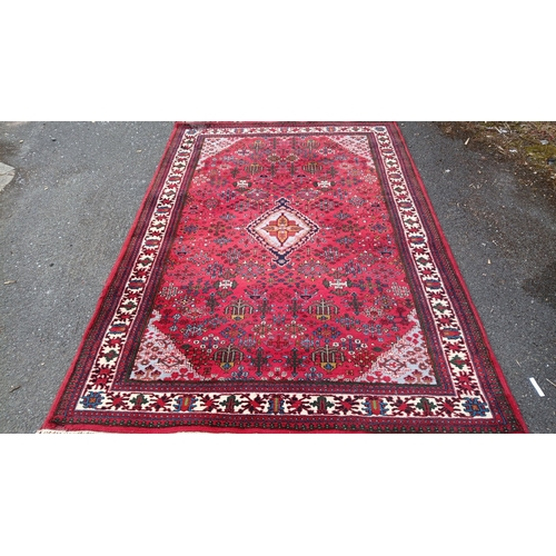 79 - Persian-style wool rug with scattered geometric and stylised floral motifs, and stepped corner spand... 