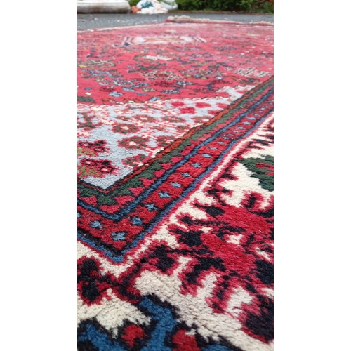79 - Persian-style wool rug with scattered geometric and stylised floral motifs, and stepped corner spand... 