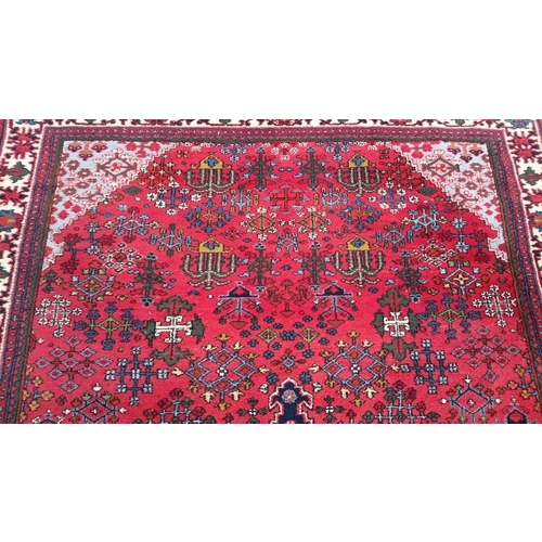 79 - Persian-style wool rug with scattered geometric and stylised floral motifs, and stepped corner spand... 