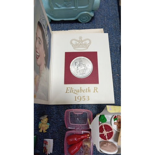 83 - An assortment of small collectibles and ephemera including a Radiance Toffee tin, rulers, novelty to... 