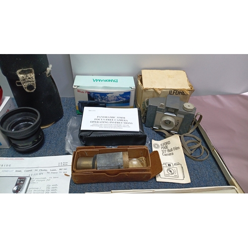 84 - A collection of photographic equipment including a Halina 35mm compact camera in box, an Ilford Pixi... 