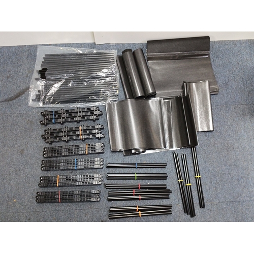 87 - A quantity of black plastic modular components to make a portable shelving unit.