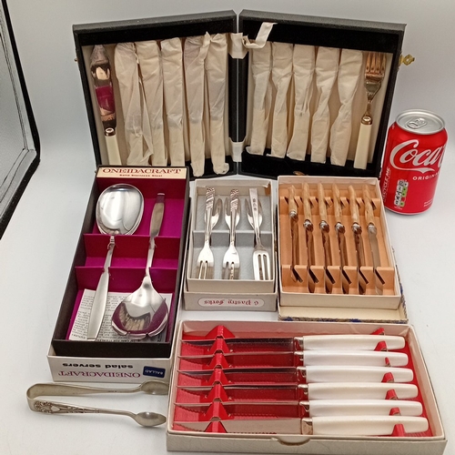88 - A group of mid-20th-century flatware and cutlery, including a OneidaCraft stainless-steel salad serv... 