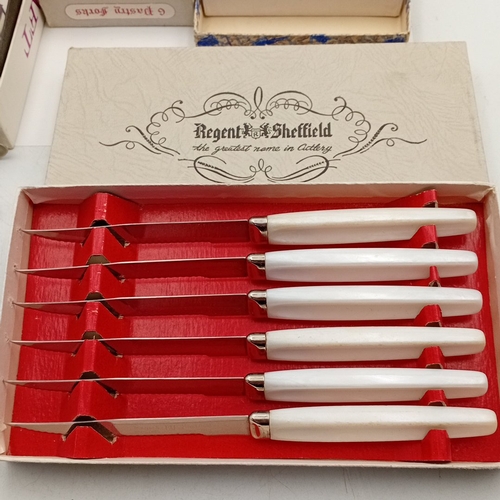 88 - A group of mid-20th-century flatware and cutlery, including a OneidaCraft stainless-steel salad serv... 