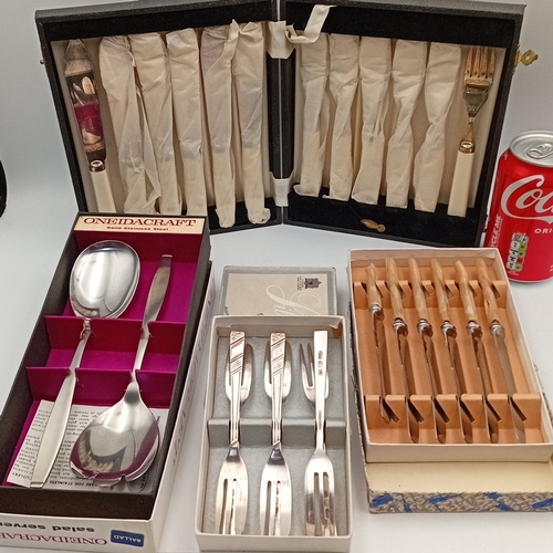 88 - A group of mid-20th-century flatware and cutlery, including a OneidaCraft stainless-steel salad serv... 