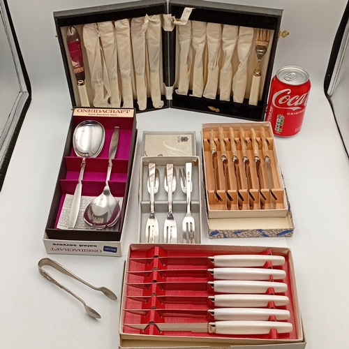 88 - A group of mid-20th-century flatware and cutlery, including a OneidaCraft stainless-steel salad serv... 