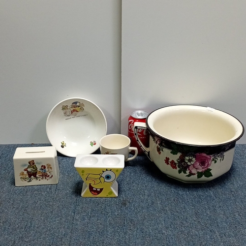91 - A group of ceramic wares including a large floral-decorated enamel chamber pot with cover, a child’s... 