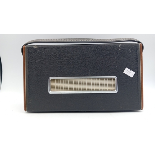 92 - Roberts solid-state portable radio, Model RIC.1—black rexine case with simulated wood ends, woven sp... 