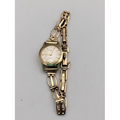 379 - A gold Roamer Incabloc 17 ladies wrist watch with original receipt watch case stamped .585/14 CT gol... 